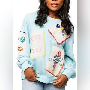 QOS Mahjong Light Blue Sweater with Colorful Patterns